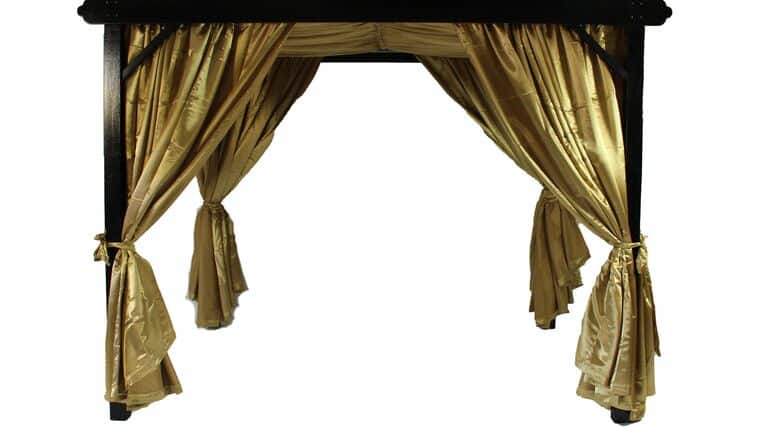 Black Small Cabana Gold Curtains square canopy with black frame and elegant gold curtains tied back at each corner, creating a lavish and inviting space with a luxurious feel.