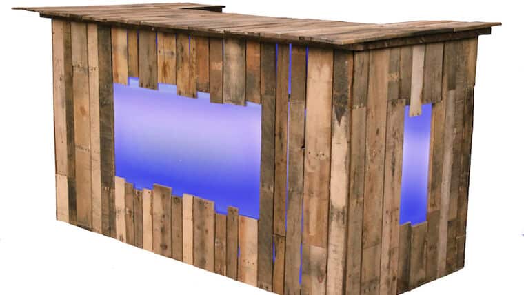 Rustic Pallet Wood Bar made from wooden pallets with a modern touch, featuring soft blue backlighting. The bar conveys a warm, inviting, and trendy vibe.