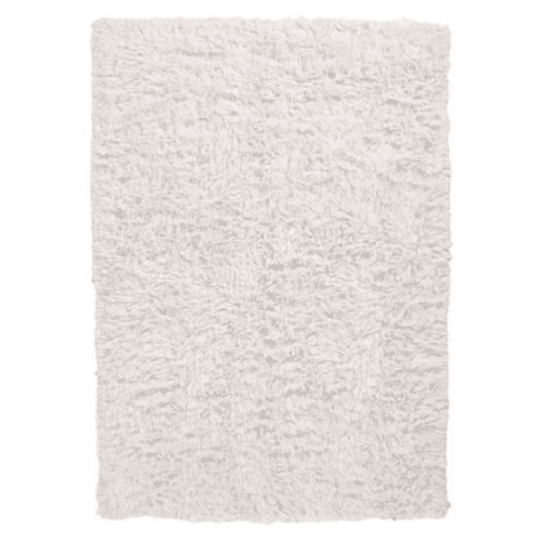 Fluffy white shag rug with a plush texture, filling the frame. The soft, cozy appearance suggests warmth and comfort, suitable for a cozy setting.